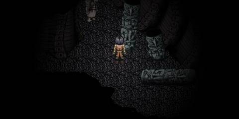 player standing near face statue