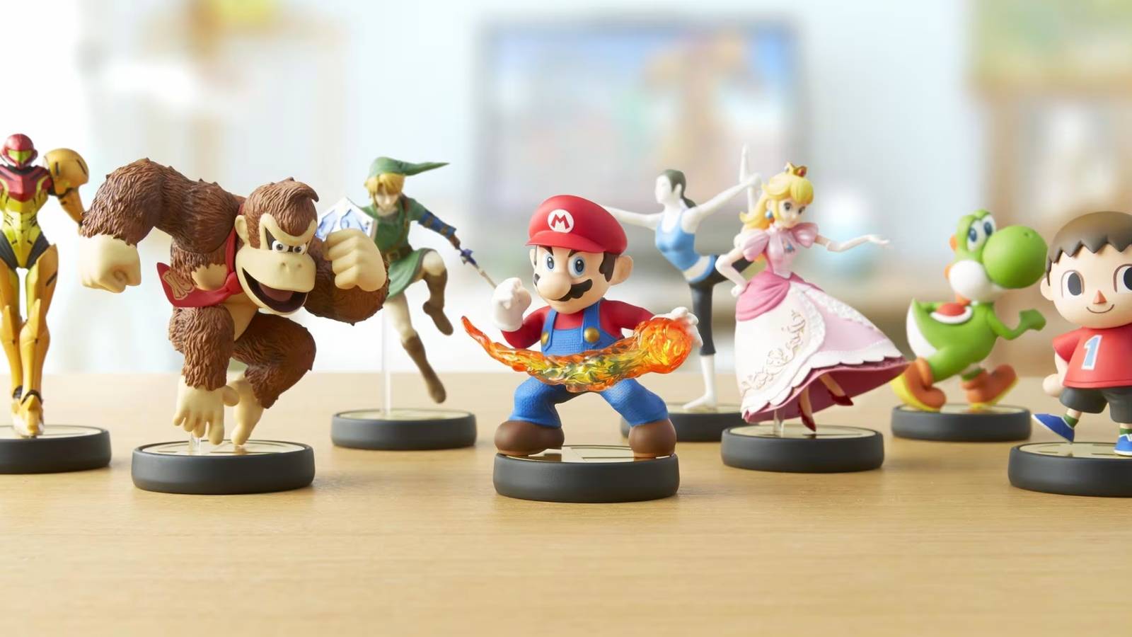 A promotional visual showing several Nintendo Amiibo figures.