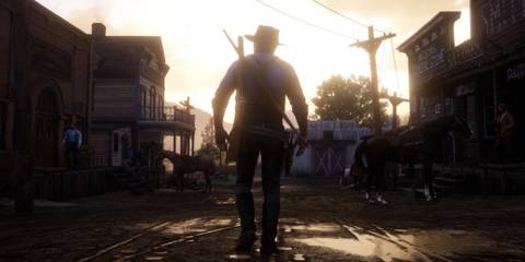 Arthur Morgan walking in front of the Sunset in Red Dead Redemption 2