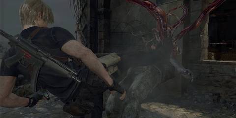 Resident Evil 4 Leon kicking a guadana