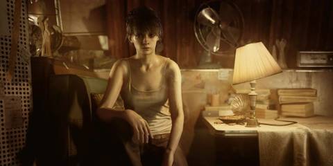 zoe baker sitting in a study in resident evil 7