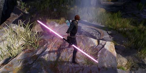 Cal Kestis wielding a double-bladed lightsaber in Star Wars Jedi: Fallen Order