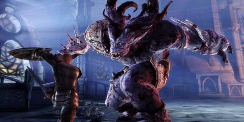 The main character fighting an ogre - Dragon Age: Origins