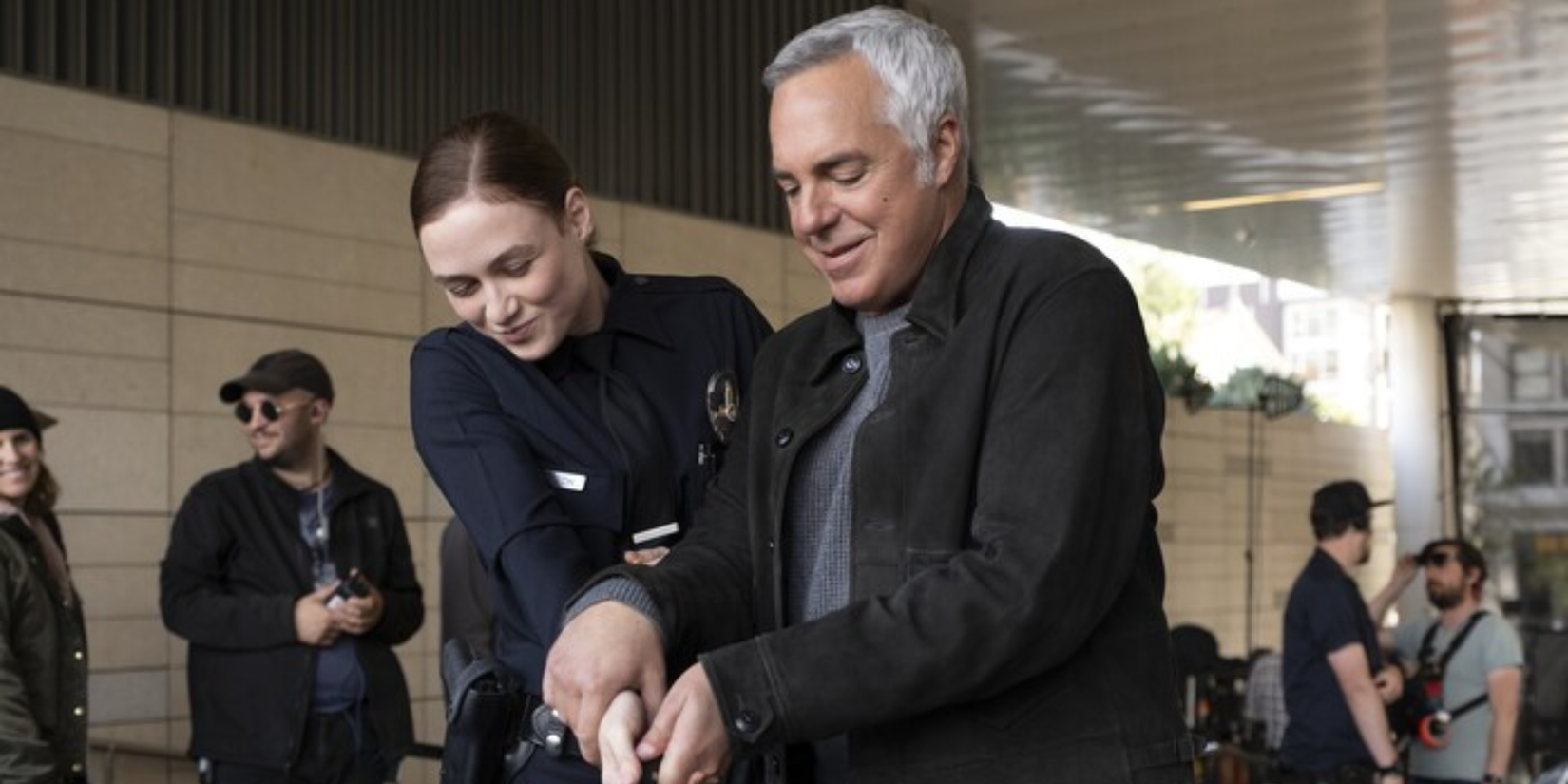Harry Bosch cutting a cake with maddie