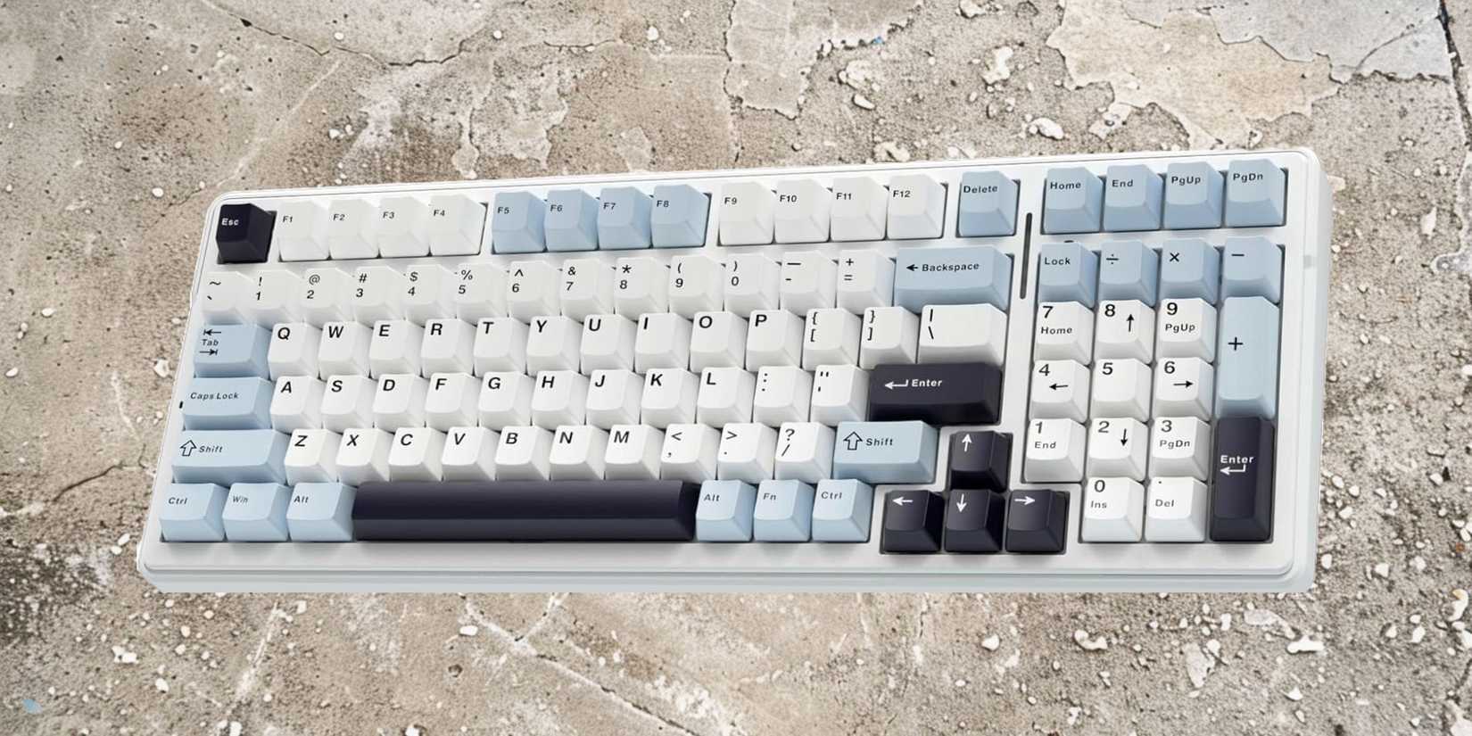 Image of a keyboard on a cracked concrete ground, representing its durability. 