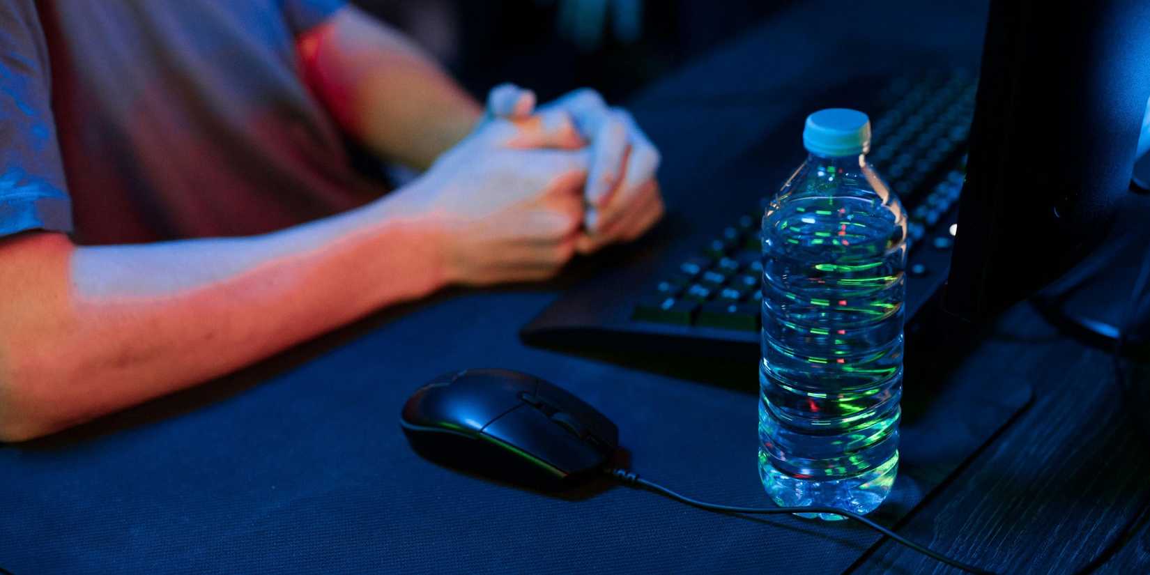 Image of a man contemplating things at a PC desk