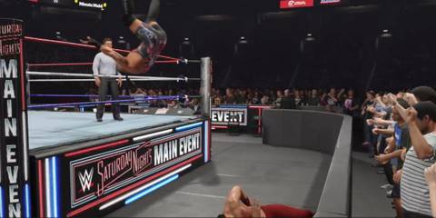 WWE 2K25 RVD dive attacks to the outside