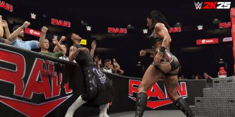 wwe 2k25 rhea ripley and dominik mysterio fighting outside the ring