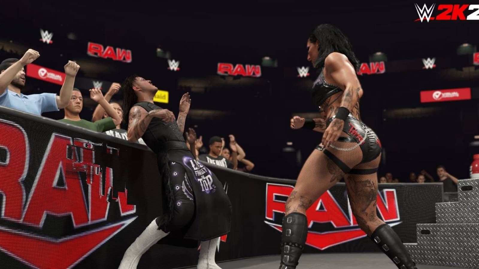 wwe 2k25 rhea ripley and dominik mysterio fighting outside the ring