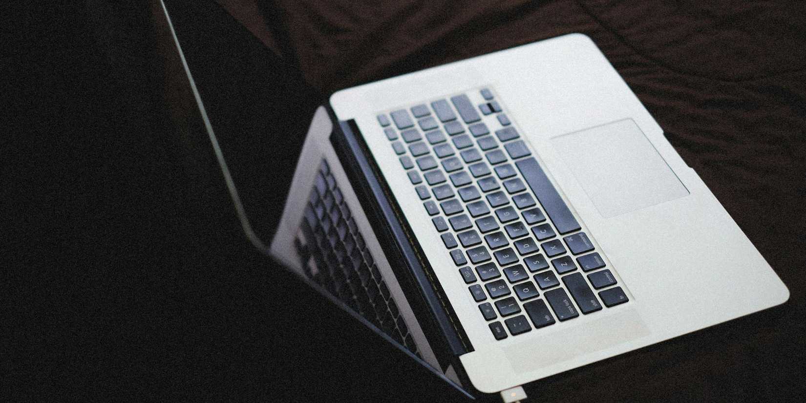 Image of a laptop being plugged in for charging.
