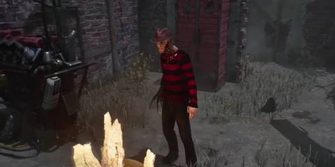 Freddy Krueger spawning into a trial next to a generator and lockers