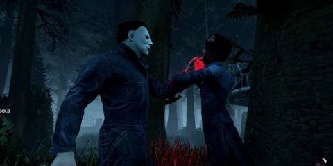 Michael Myers grabbing a survivor by the collar and holding them up