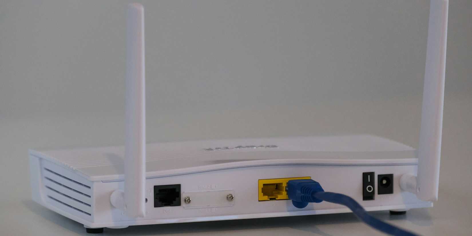 Image of a WiFi router on a white background. 