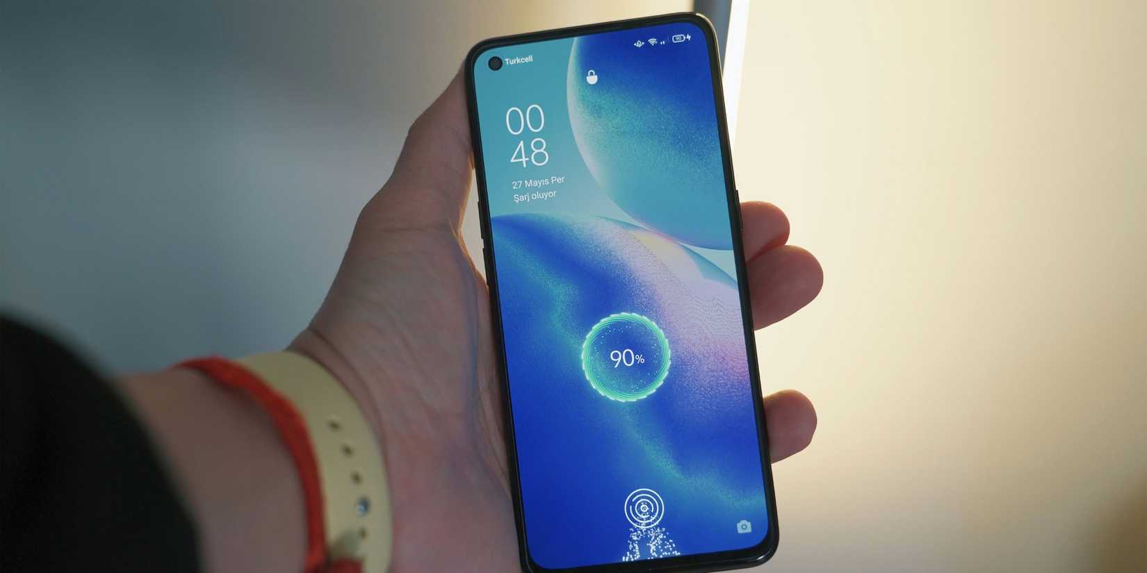 Image of a phone being charged just over 90%. 