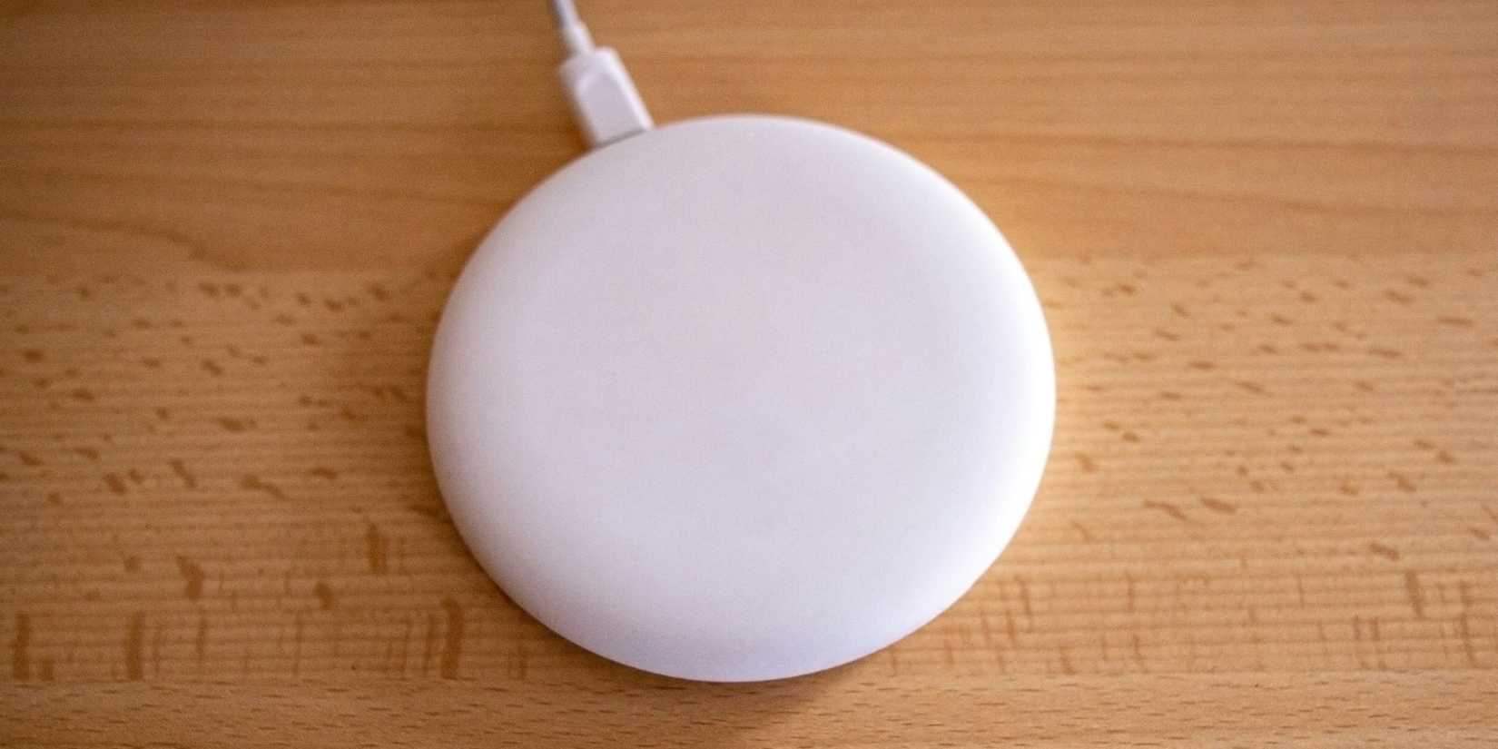 Image of a wireless charger on a desk. 