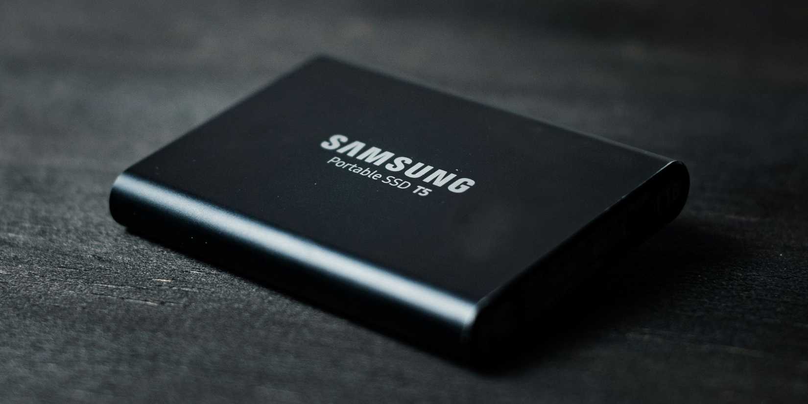 Image of a Samsung SSD on a black, neutral background. Probably a table.