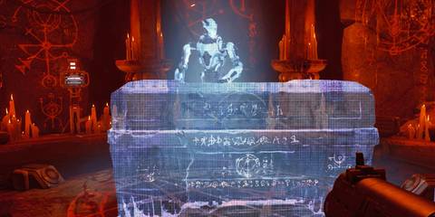 A hologram of Dr. Samuel Hayden observing the Doom Slayer's sarcophagus