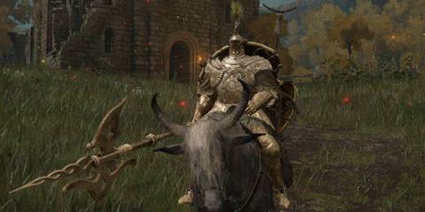 Elden Ring Tree Sentinel standing idle outside of ruined church