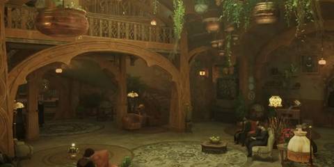 The cozy, plant-filled common room of a Hogwarts house in Hogwarts legacy 
