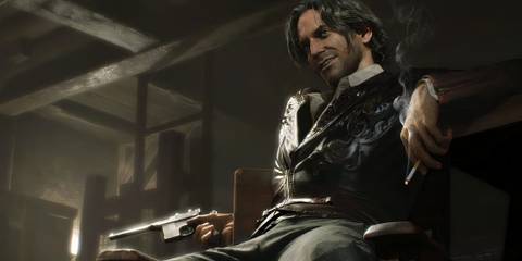 Luis sitting down with a cigaretee and Red-9