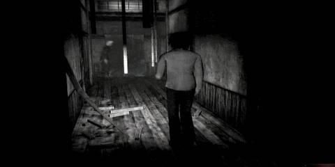 Girl walking through a dark room with a ghostly figure in the foreground in Fatal Frame