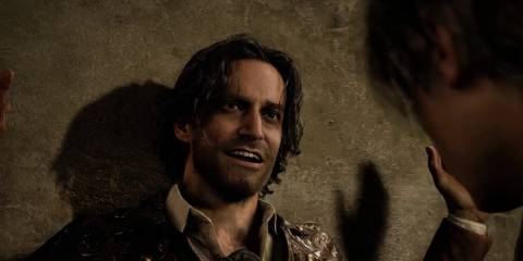 Luis being held up against a wall by Leon