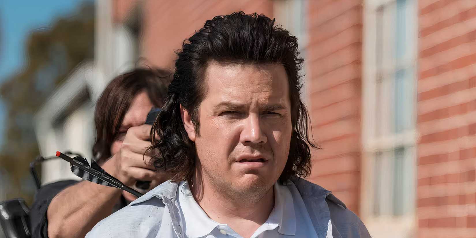 Daryl aiming a gun at Eugene in The Walking Dead