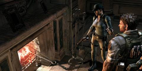 Chirs and Jill standing by a fire