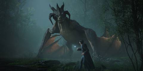 A wizard faces a giant horned dragon in a misty forest in Hogwarts Legacy