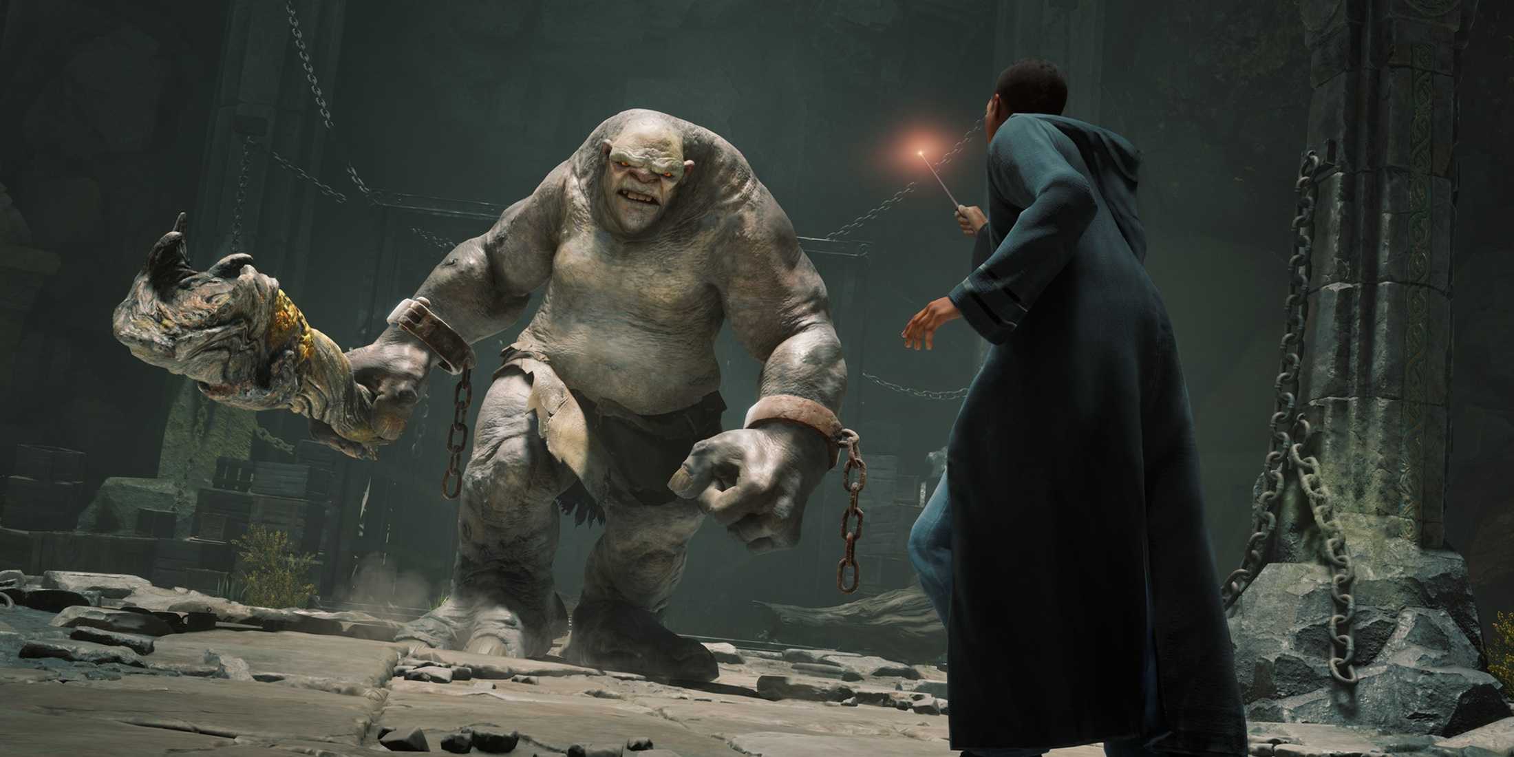 Hogwarts student faces off against a massive, chained troll in Hogwarts Legacy