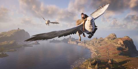 Hogwarts Legacy character rides a majestic white Hippogriff across a sweeping coastal landscape