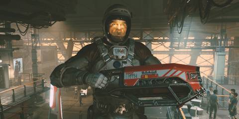 A  character in Starfield with a space man suit holding a gun