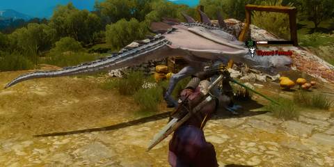 Geralt of Rivia fighting a Slyzard Female in The Witcher 3: Wild Hunt