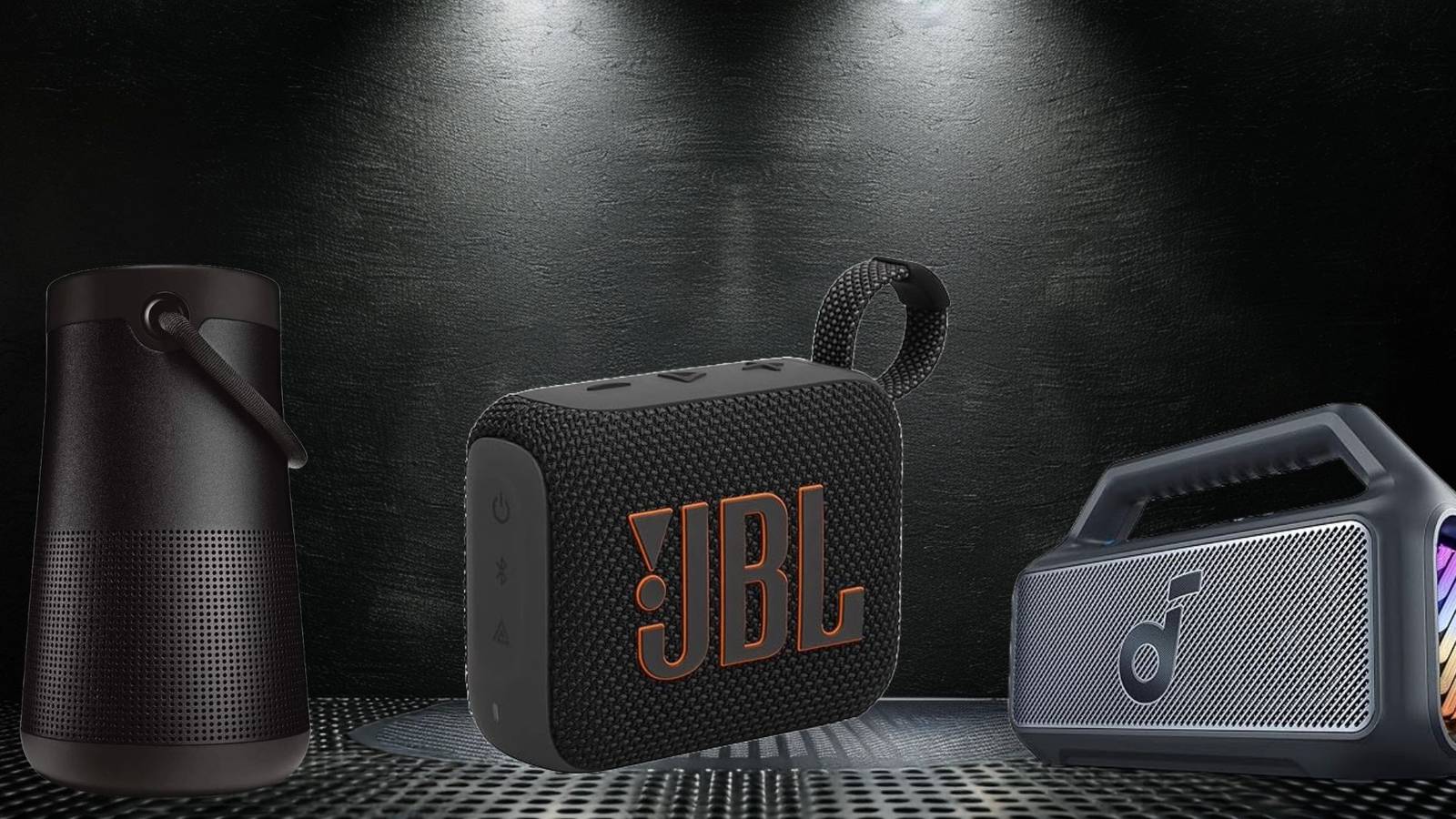 Image of three portable bluetooth speakers on a black background. 