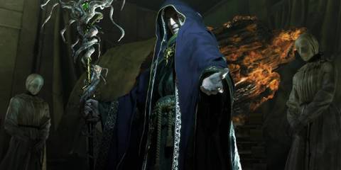 Osmund Saddler cloaked with his arm reaching out in Resident Evil 4 Remake