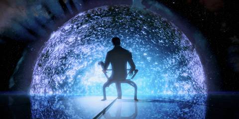 The Illusive Man sitting facing away from the screen, overlooking a glowing sphere in Mass Effect 2.