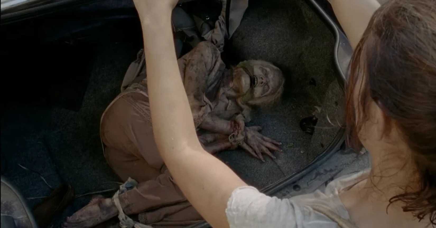 Walker tied up in a trunk - the walking dead