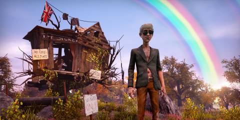 A wastrel in scruffy clothing stands before a broken treehouse freamed by a rainbow