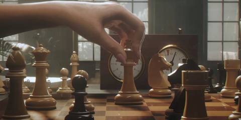 A woman playing chess in 007 First Light
