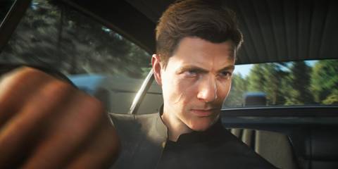 James Bond driving the Aston Martin DB5 in 007 First Light