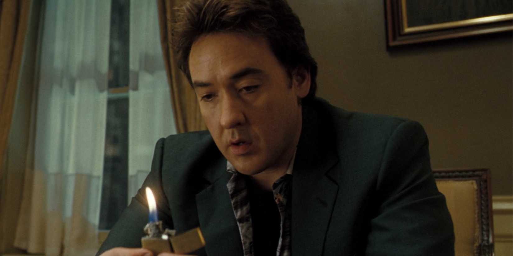John Cusack as Mike Enslin in 1408