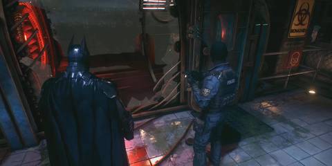 Batman observing the broken special containment cell in Batman: Arkham Knight
