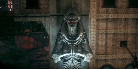 A statue warped into Joker's image in Batman: Arkham Knight