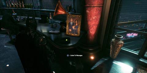 Batman listening to his answering machine in Batman: Arkham Knight