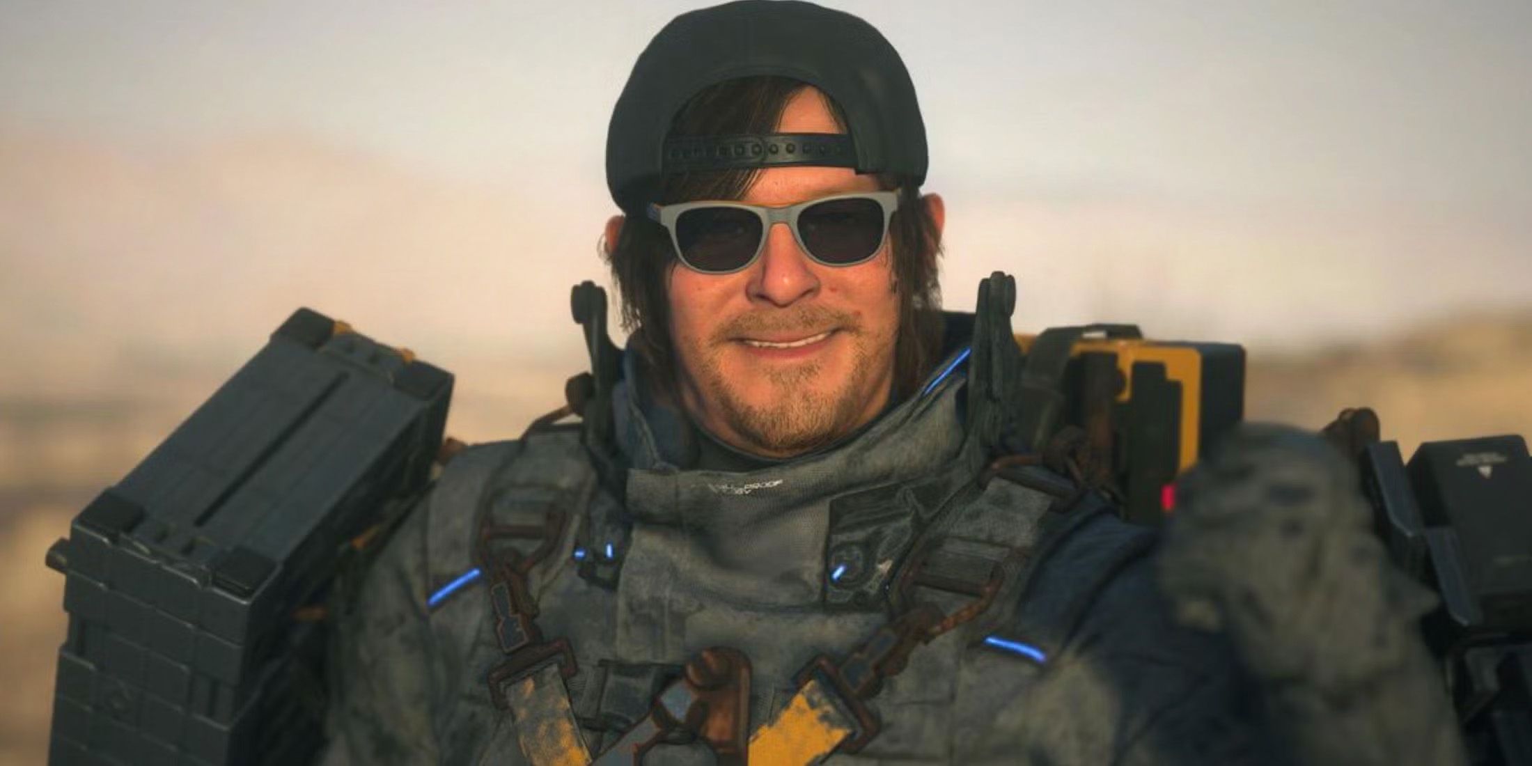 Death STranding 2 On the Beach Norman Reedus as Sam Porter Bridges smiling close-up