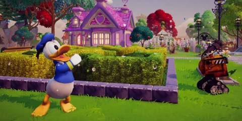 Donald Duck and WALL-E in a vibrant garden maze near a pink cottage in Disney Dreamlight Valley