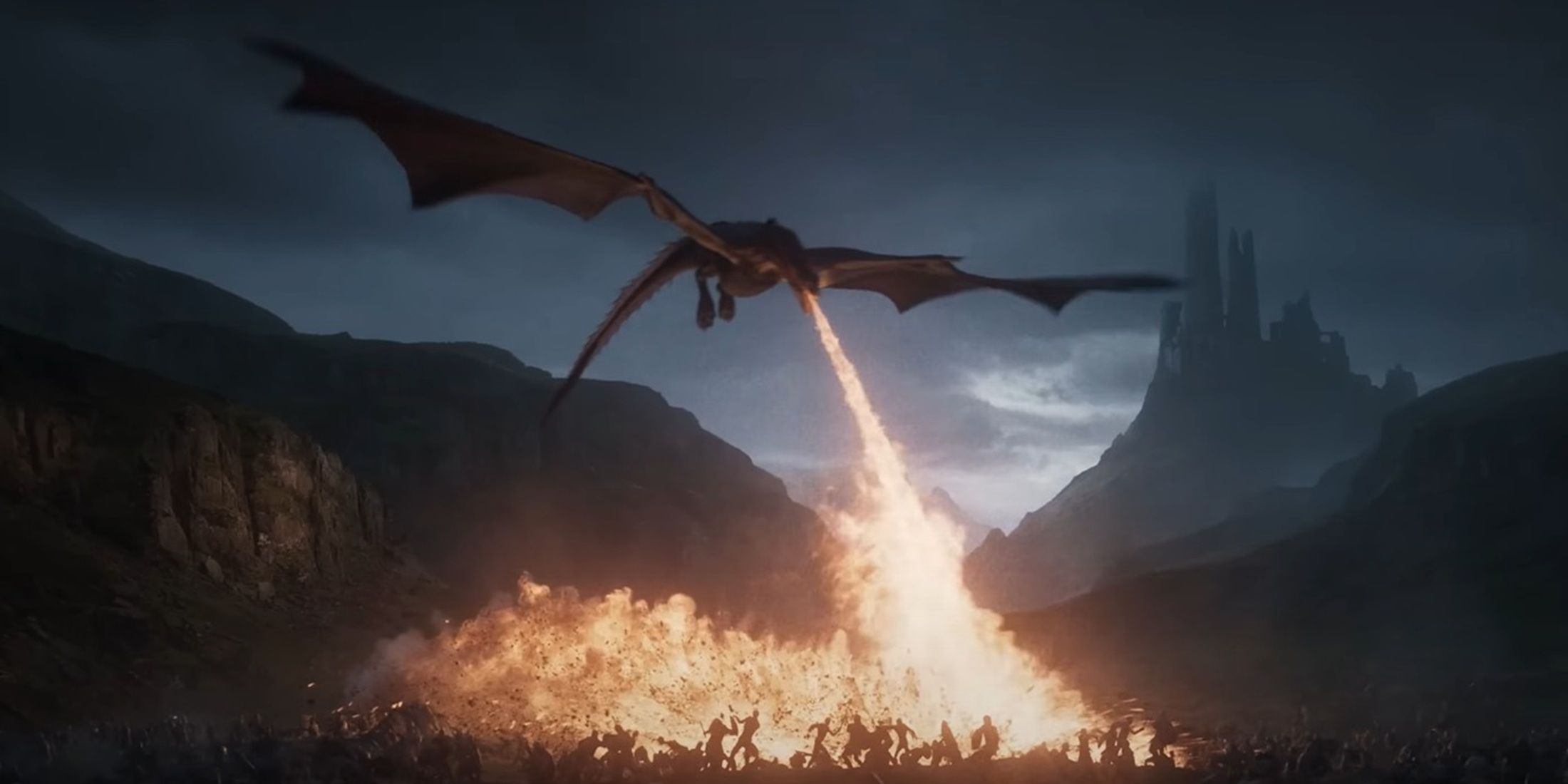 A dragon breathes fire onto a battlefield at dusk with a dark castle in the distance, from Game of Thrones: War for Westeros.
