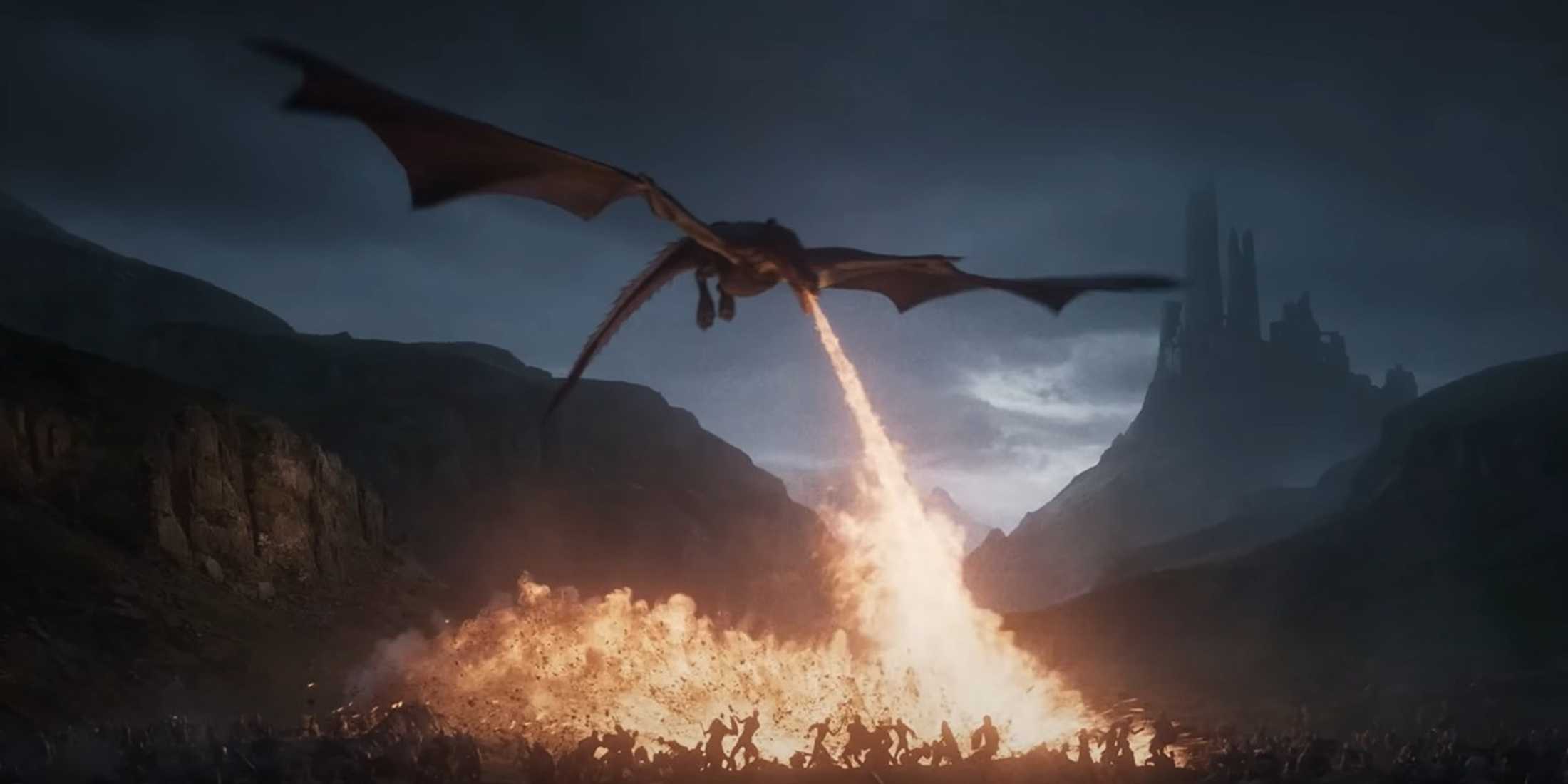 A dragon breathes fire onto a battlefield at dusk with a dark castle in the distance, from Game of Thrones: War for Westeros.