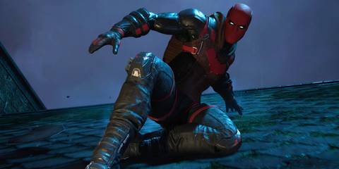 Red Hood sliding down a rooftop in Gotham Knights