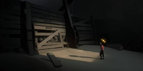 Inside boy approaching wooden wall